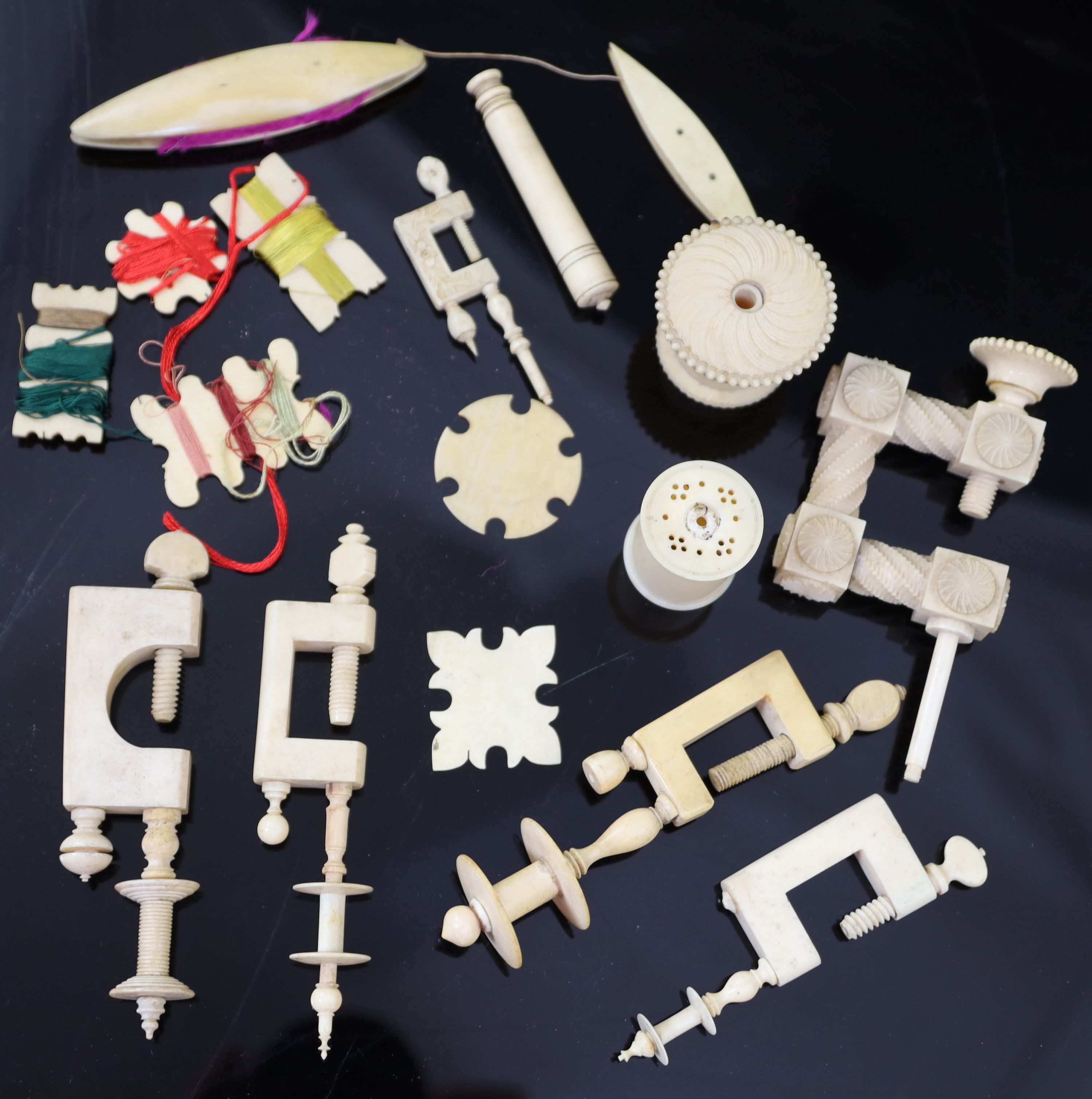 A collection of assorted early 19th century and later ivory sewing accessories